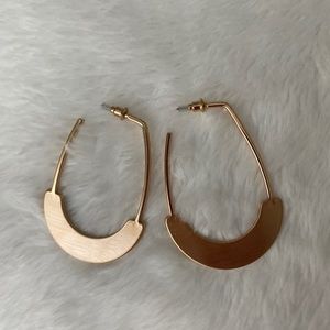 Large, partial hoop gold earrings